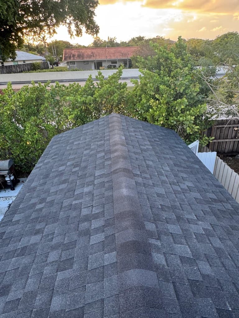 Completed architectural shingle roof at sunset