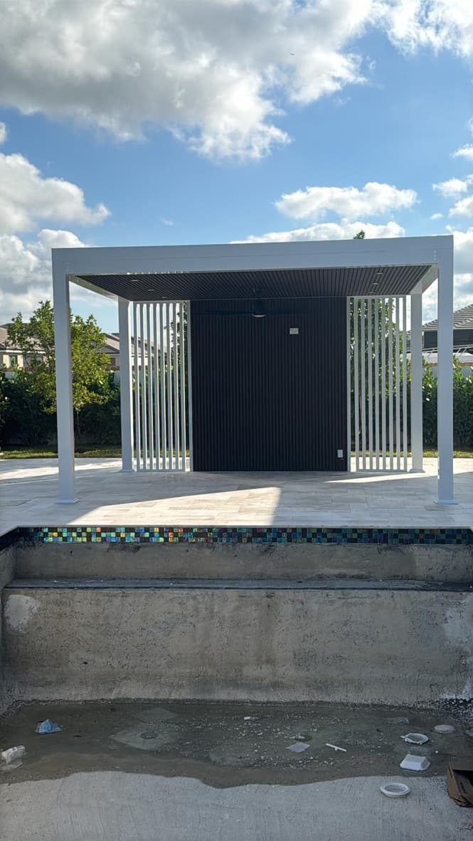 White pergola with outdoor lounge area